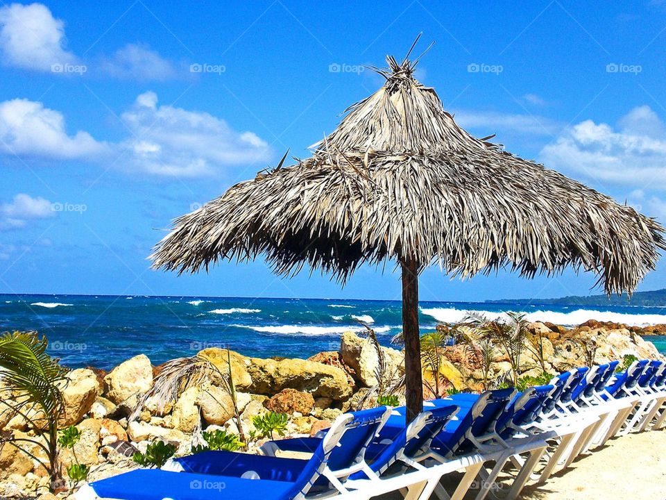 Close-up of thatched roof on beach