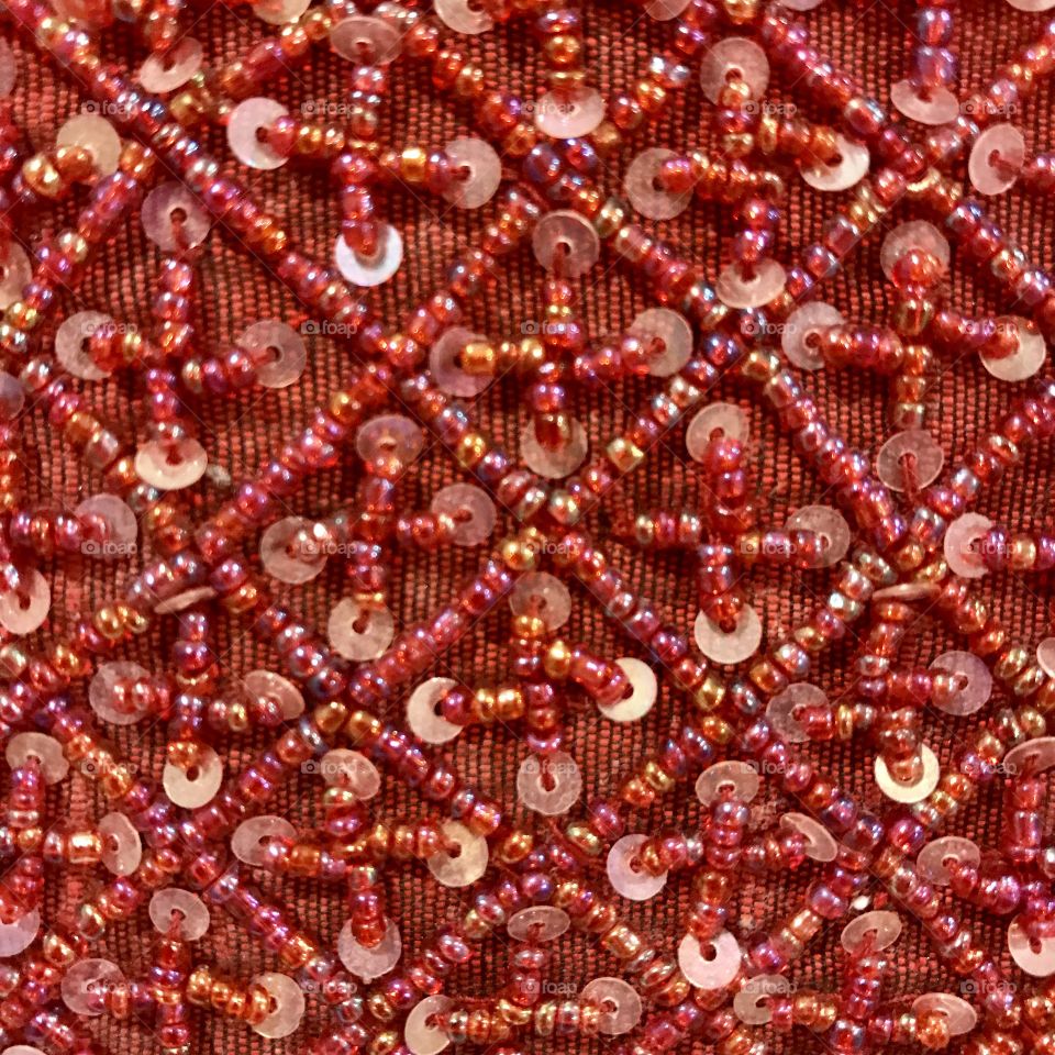 Red Beads on Red Fabric