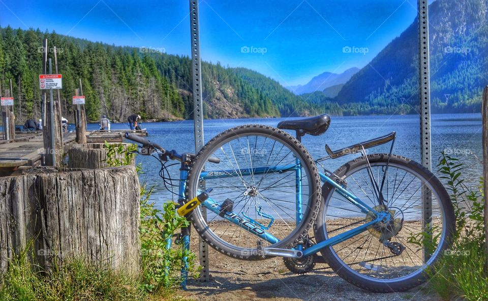 Bike ride to remote lake to fish. Bike locked up at lake, to fish off dock