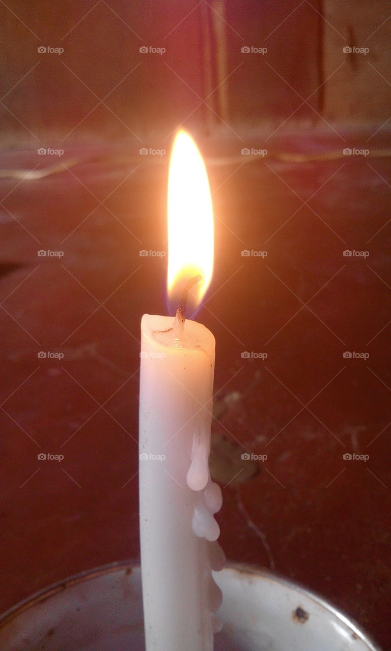 I light a candle for a prayer for guidance, faith, hope, peace for all people and all country
