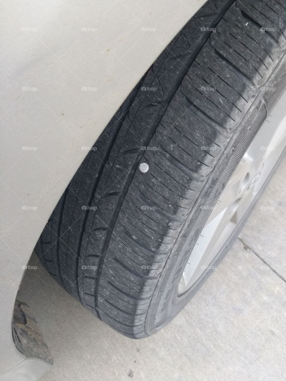 my tire with a nail in it. living near construction.