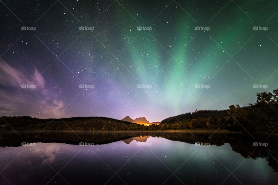 Reflection of northern lights in lake