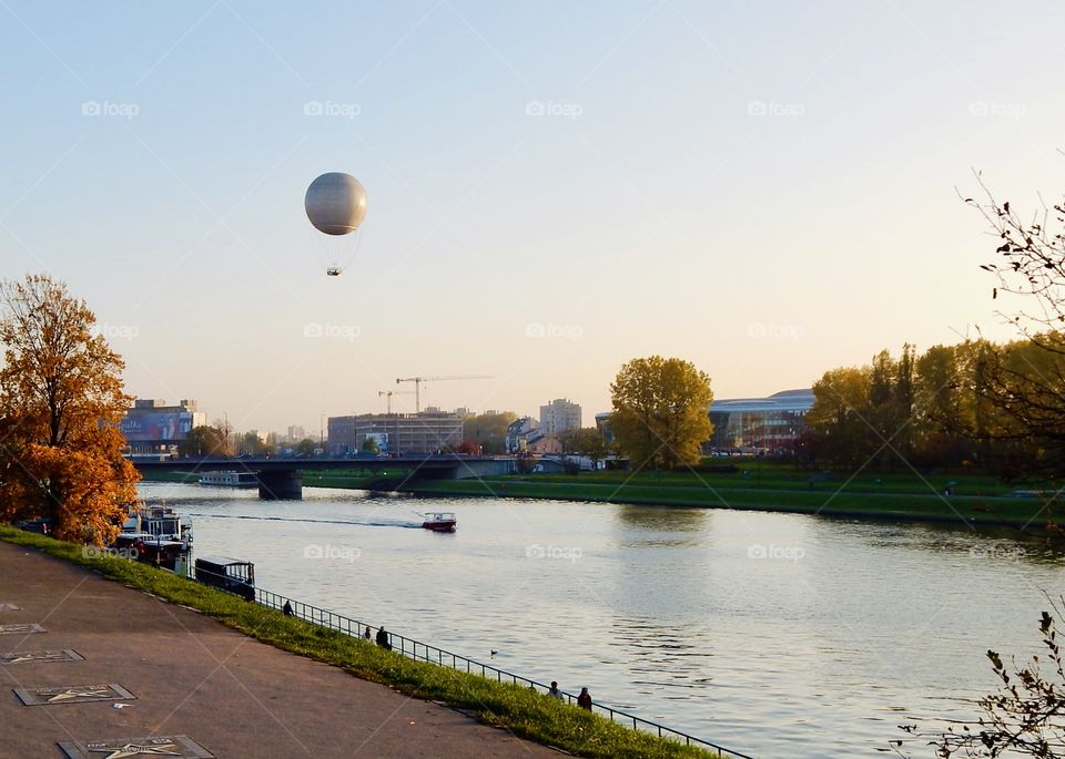 View on Wisla river in Krakow and big air balloon 