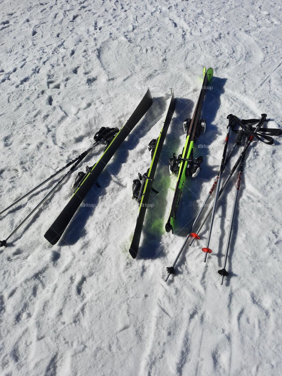 skis and ski poles on the snow
