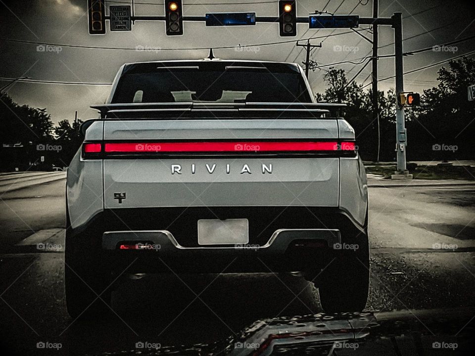 Commute - Rivian electric truck in front