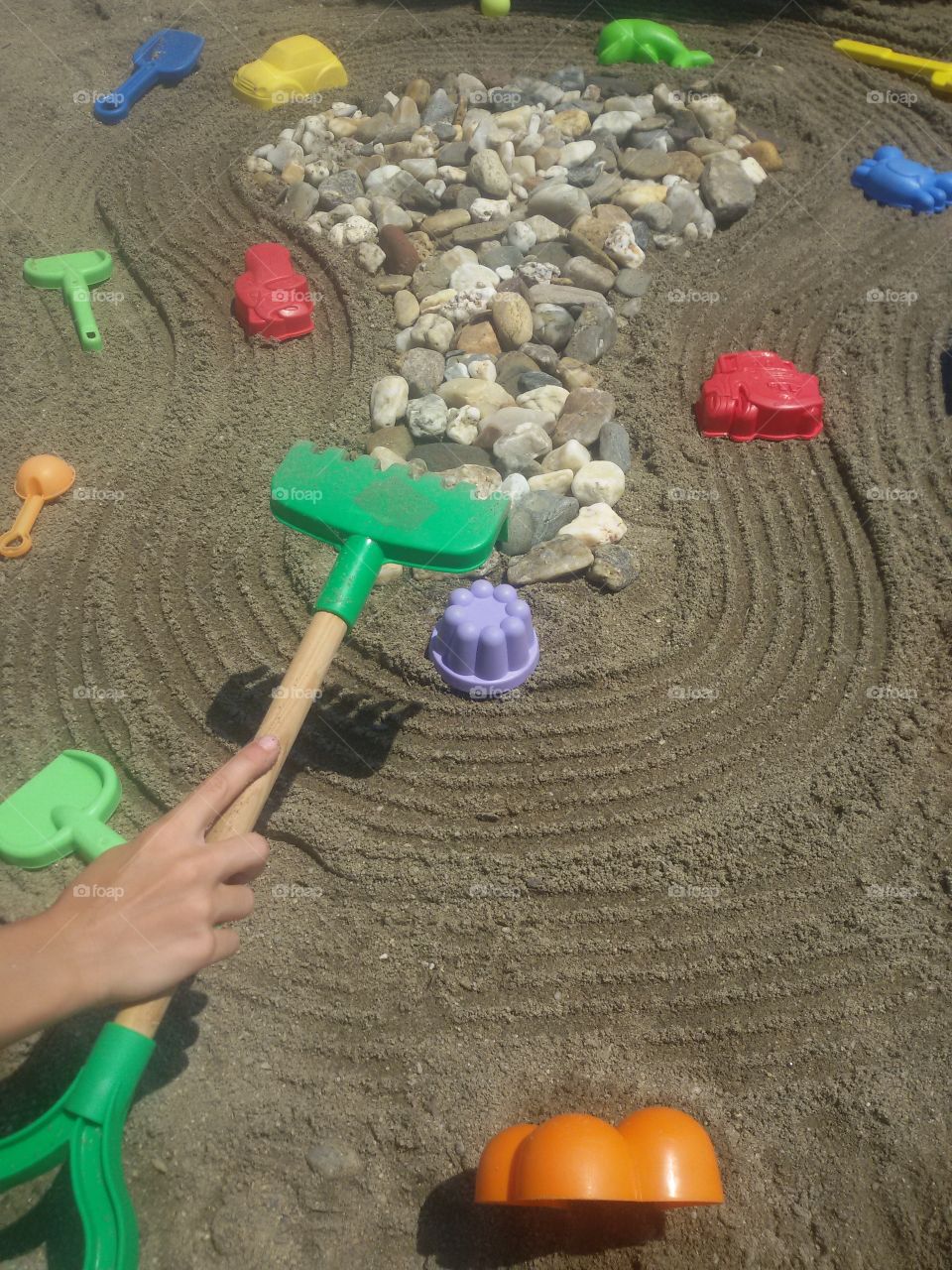 Children with toys on beach