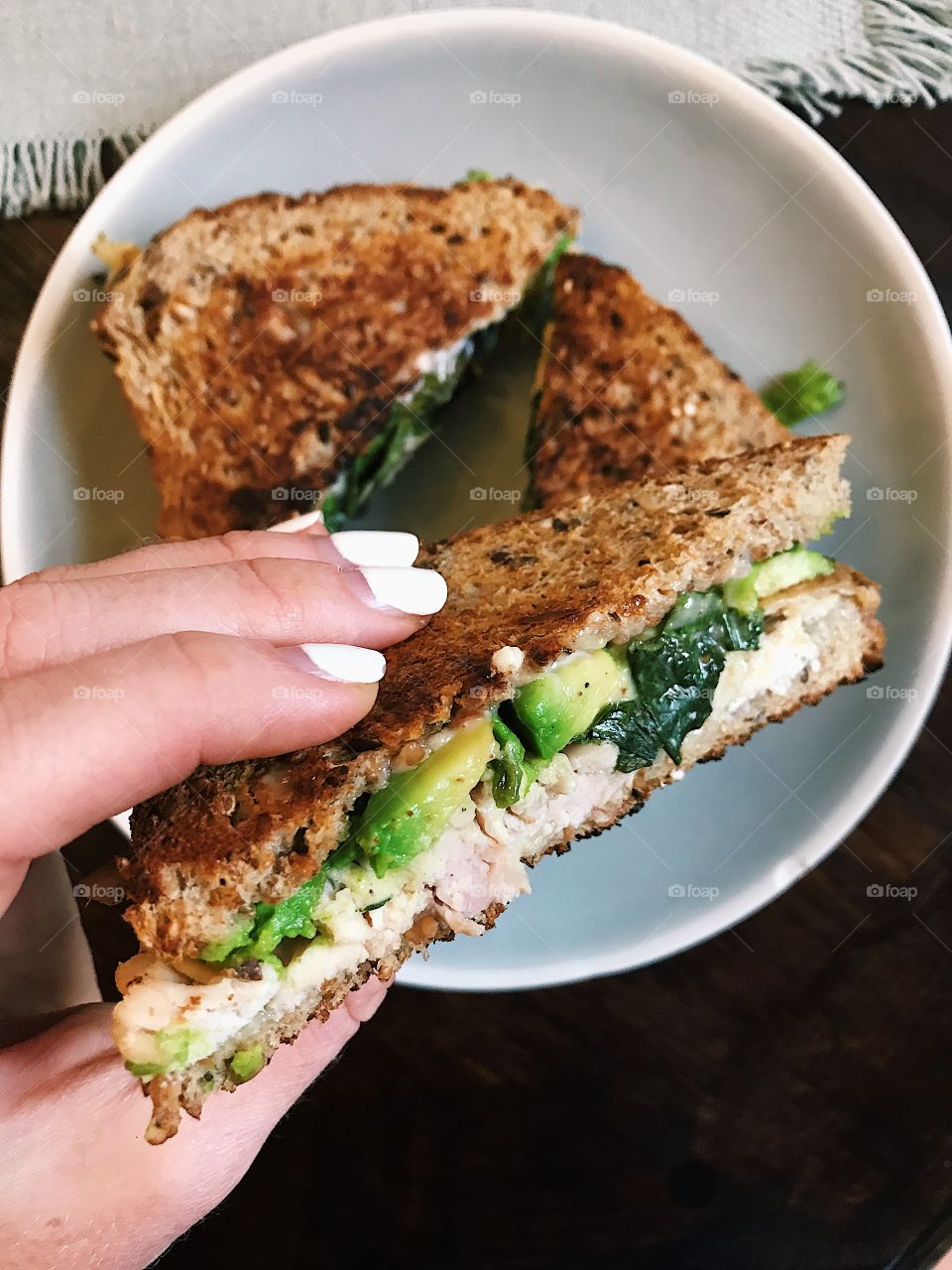 Savory and delicious turkey avocado panini with spinach and melted Swiss!