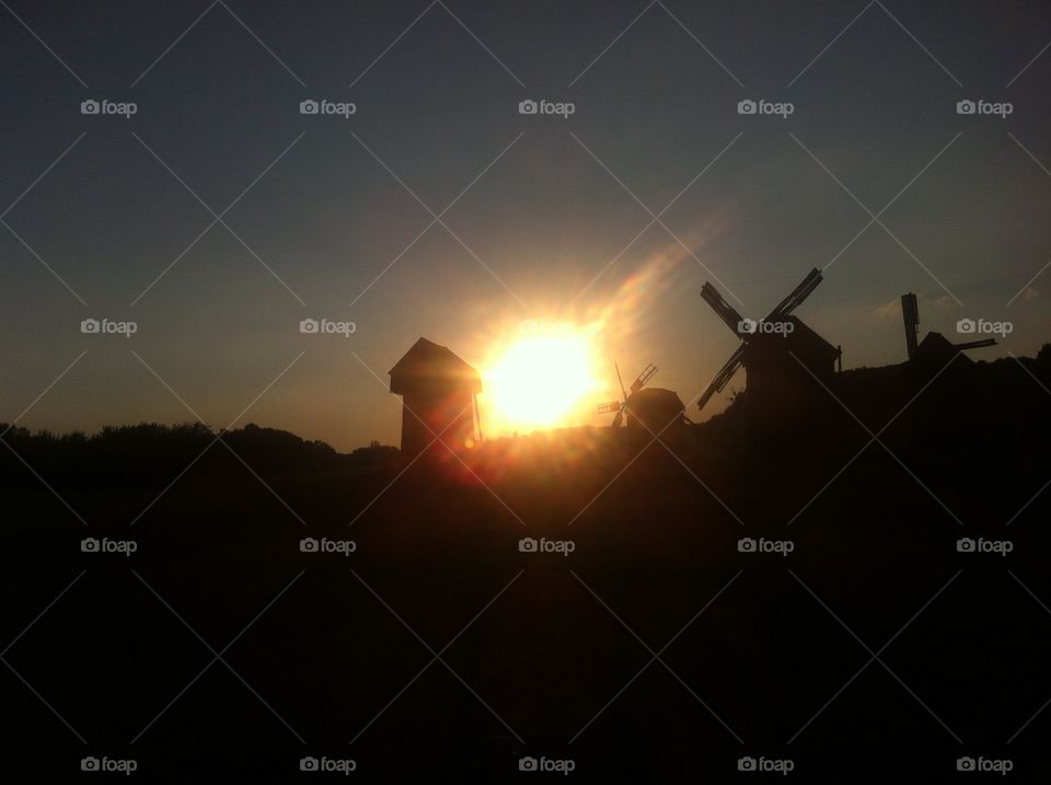 Windmills in sun rays 