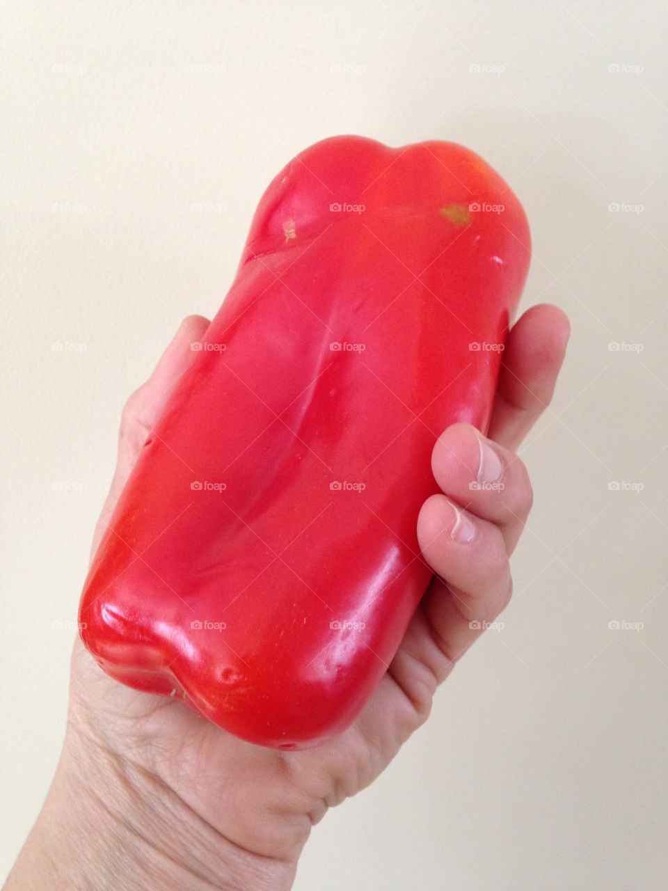 Holding red pepper 
