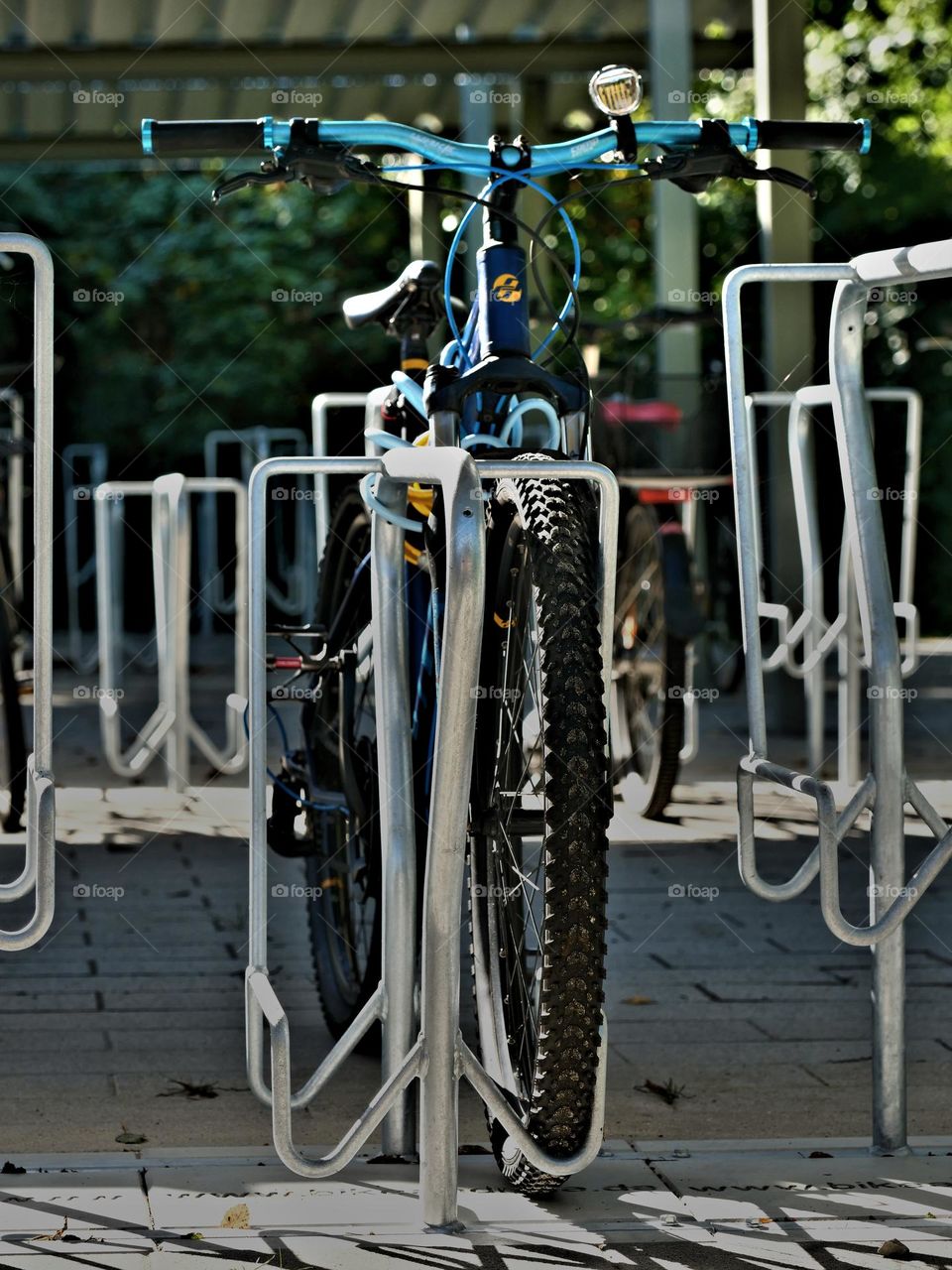 blue bike in bike rack