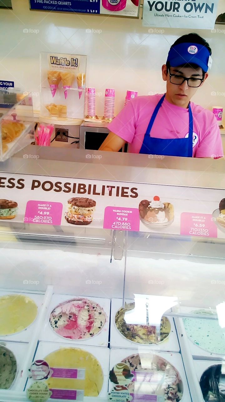 Small Ice cream Business in California, a Young Worker scooping up ice cream.