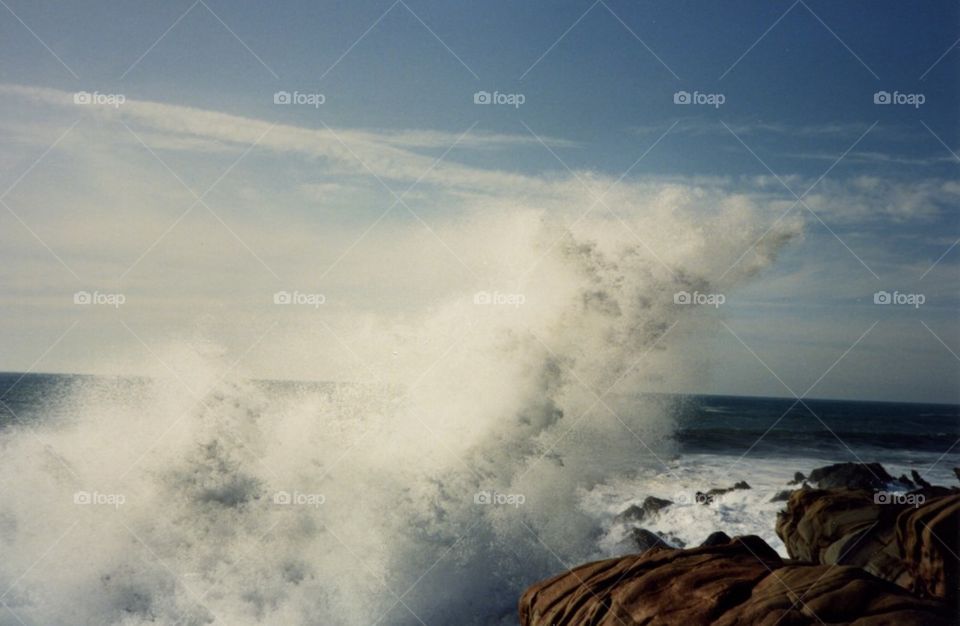 Waves splashing on coastline