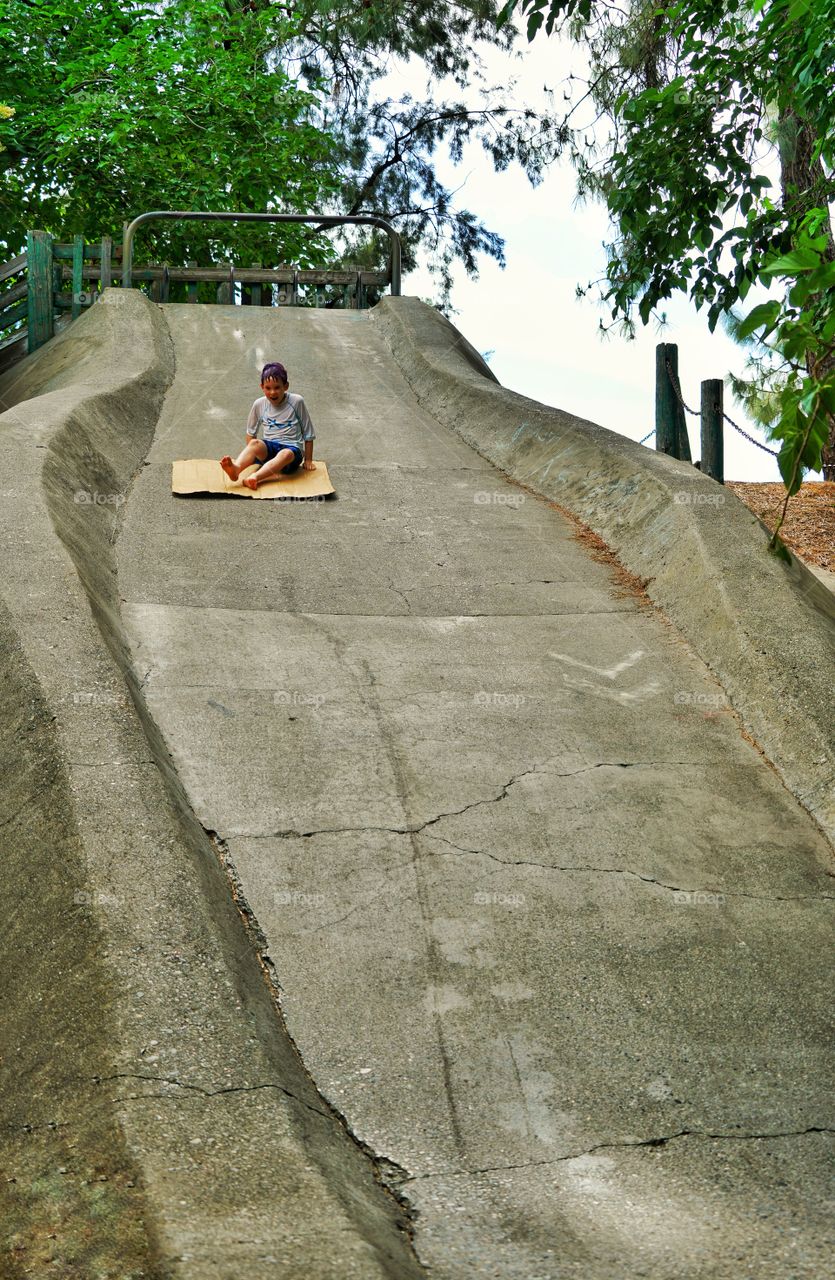 Boy On A Giant Slide