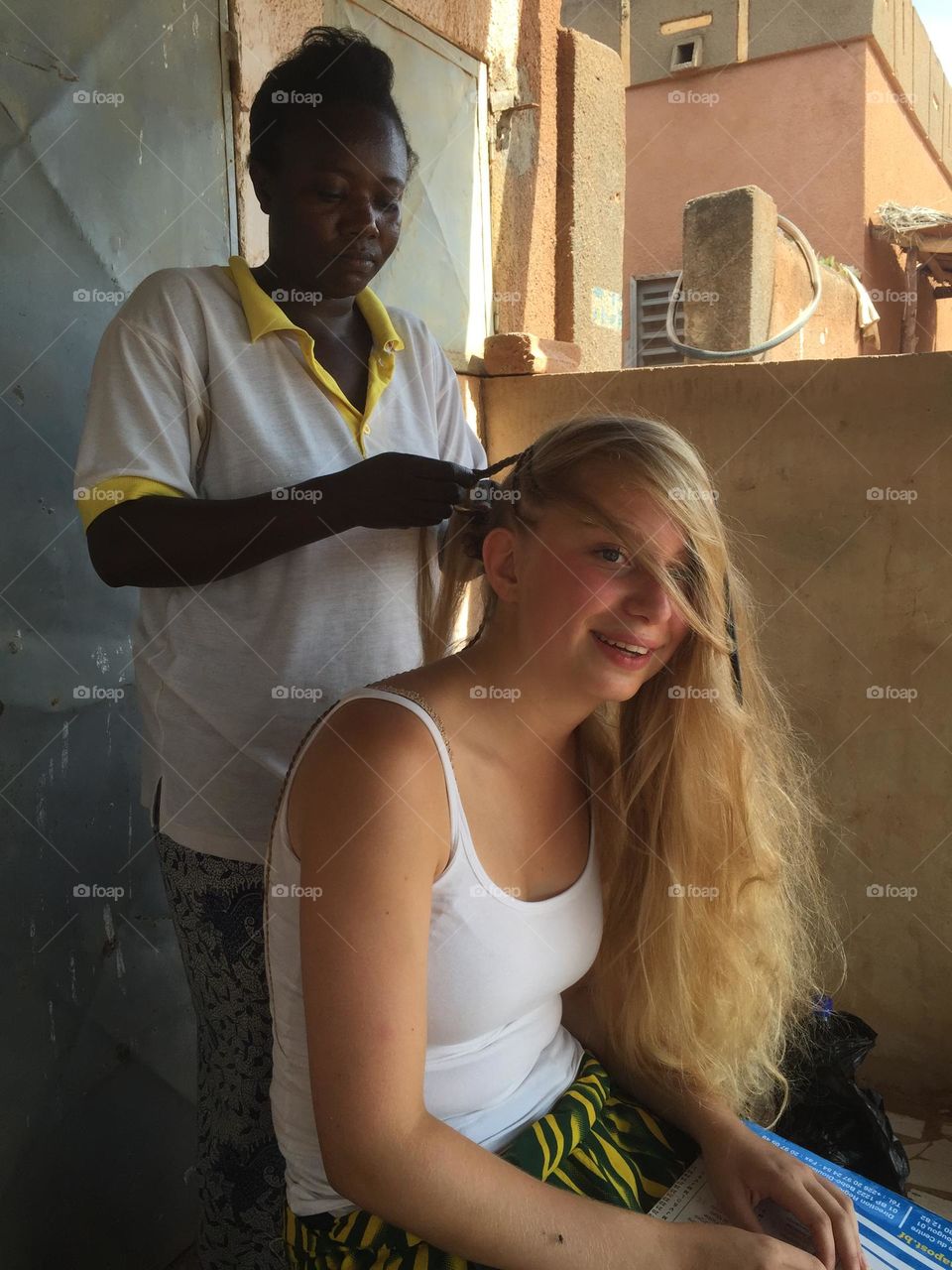 Blond girl going to a saloon to get hair braided