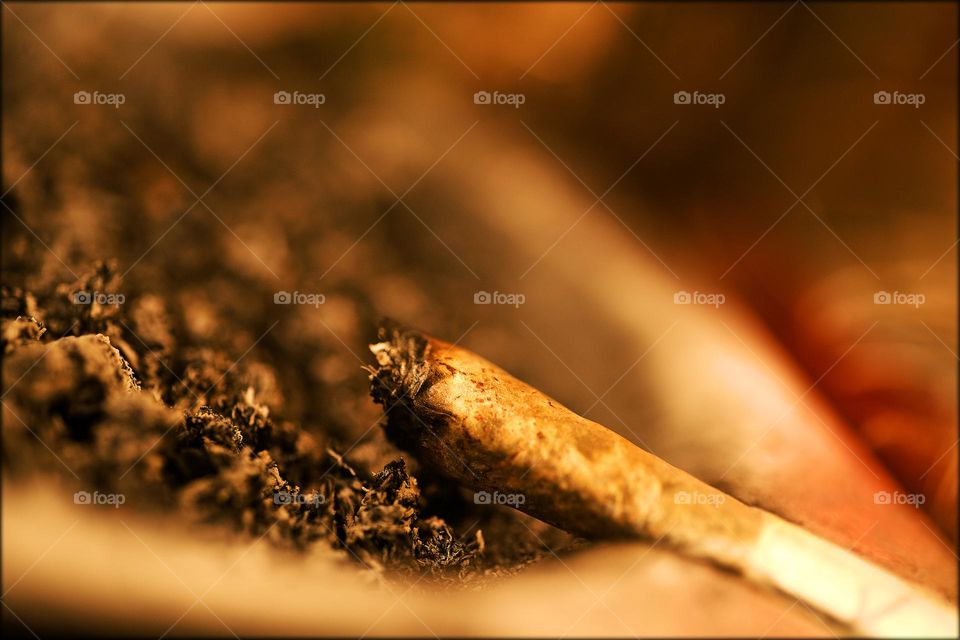 Weed cigarette close up background smoking marijuana medical cannabis high time hustling daydreaming