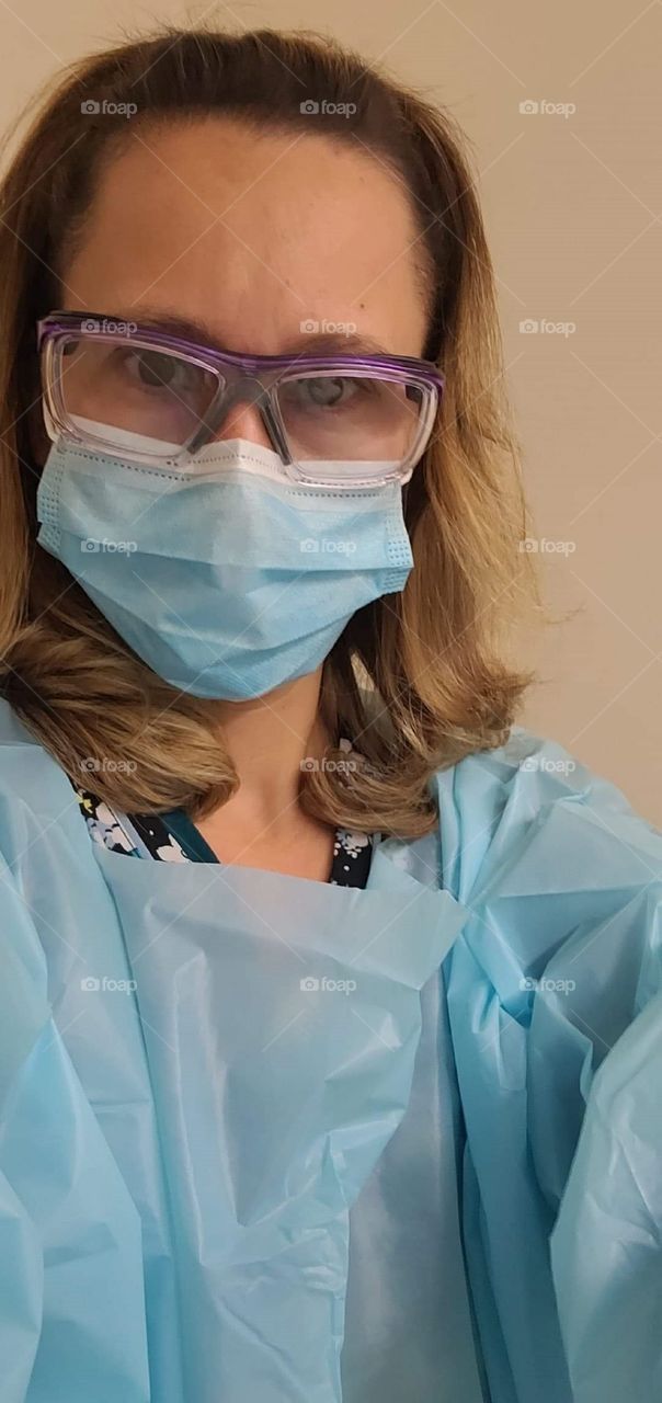 Nurse Wearing Protective Gear  & Mask During Covid-19 Pandemic