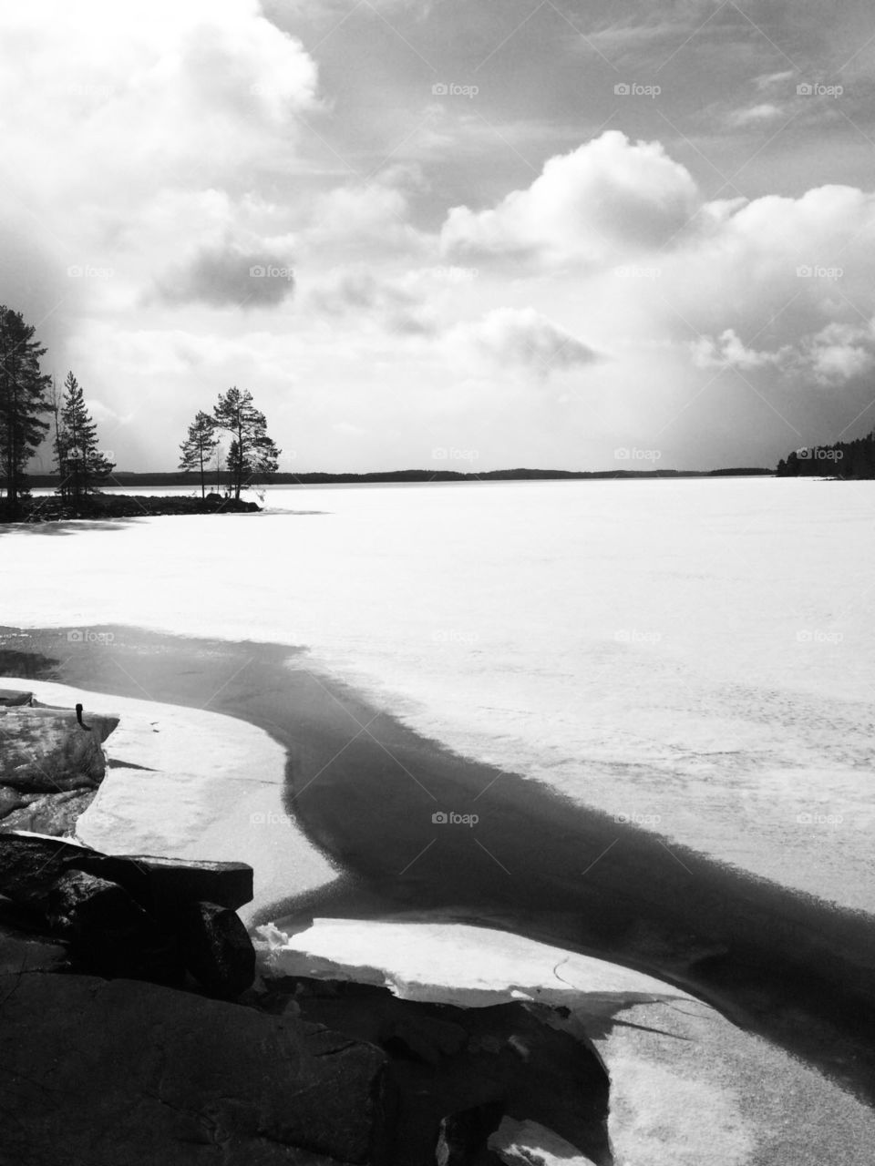 Black and White winter view to a Frozen lake 