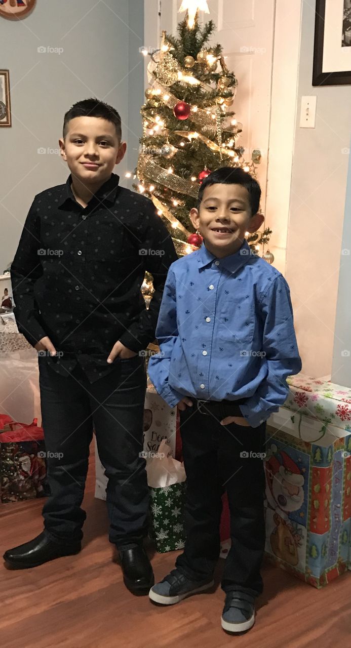 Boys in front of the Christmas tree