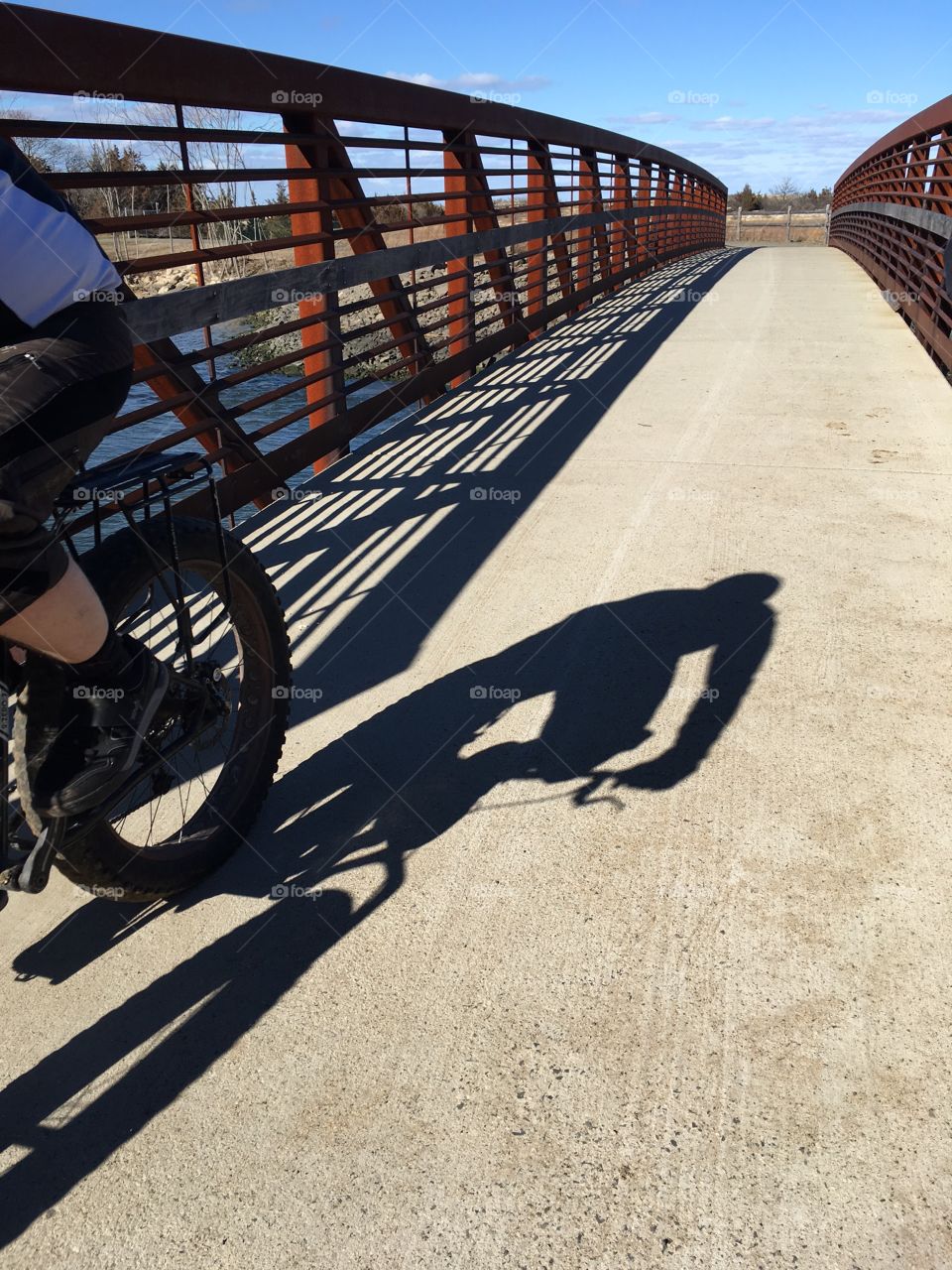 Shadow of bicyclist.