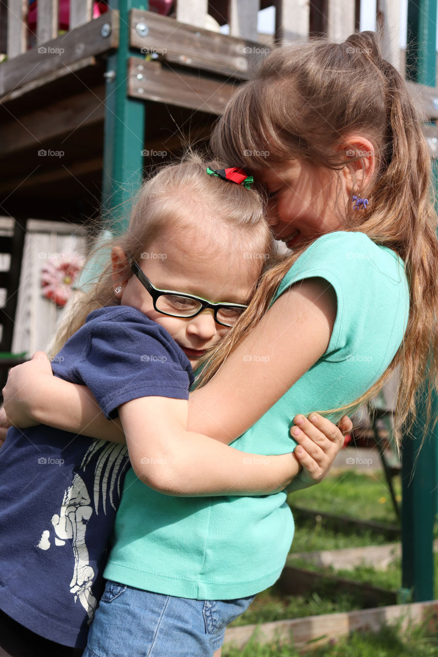 Sisters hugging each other