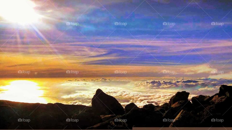 sunset over the clouds on Mount Haleakala