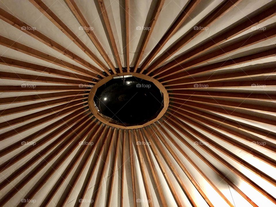 The ceiling of a yurt is simple and complex at the same time, while also being esthetically pleasing and functional.  