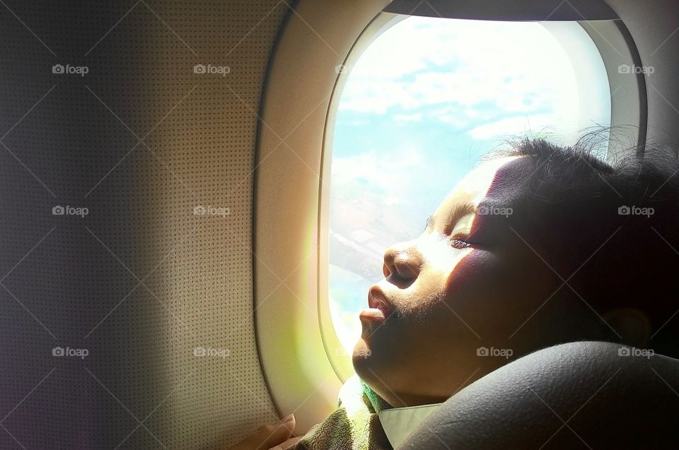 Girl Sleeping on the Plane
