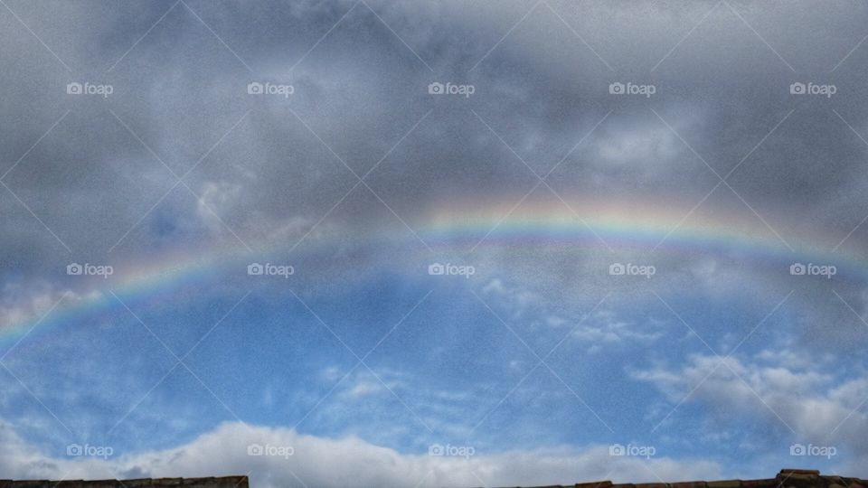 The rainbow between clouds