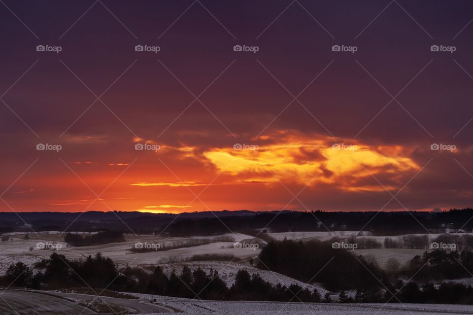 From an afternoon with a colorful but yet cold sunset. I just love those red, orange and yellow colors.