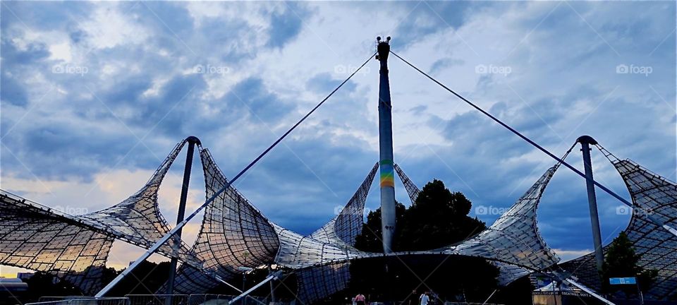 These futuristic structures resemble a spaceship right out of “Star Trek”. They adorn the vast plaza of the stadium for the “1972 Olympics” in “Munich”, Bavaria. Impressive then, they still attract tourism today. 2024. Hypnotic Productions