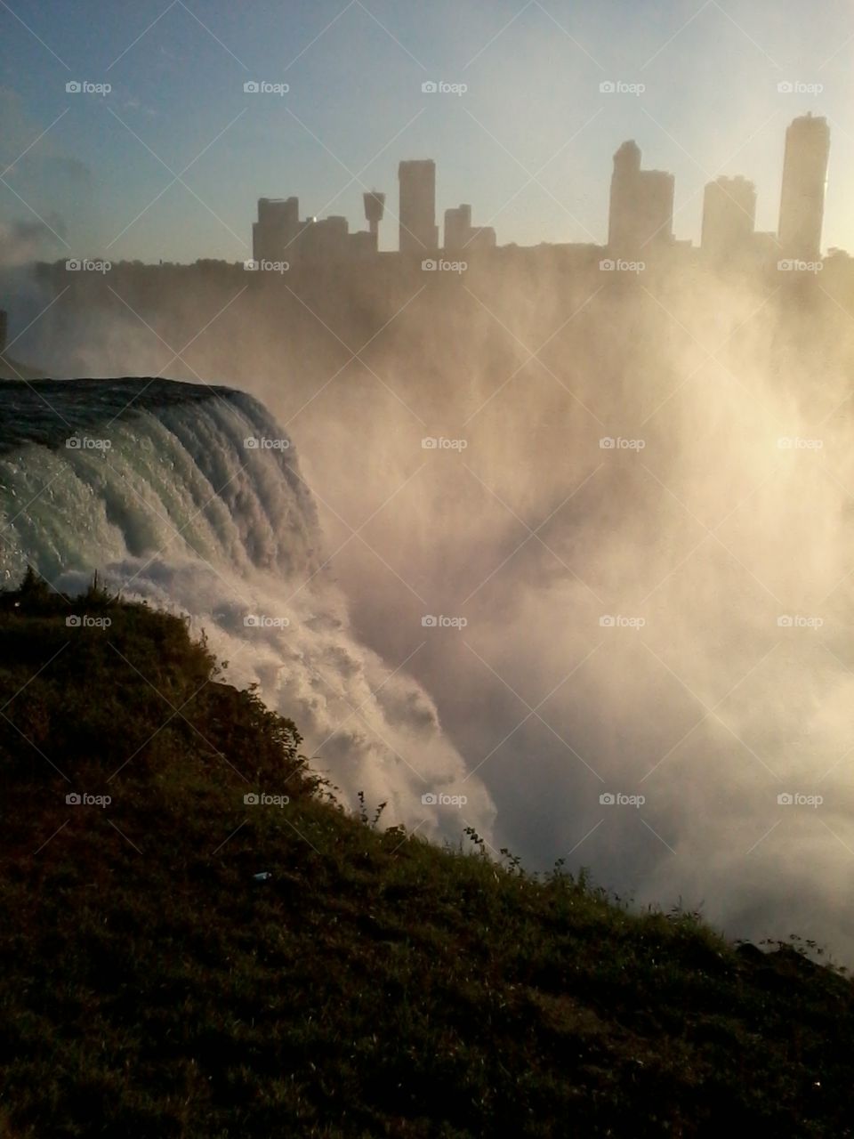 Skyline of Canada. Niagara Falls with Canada side in background beyond the mist.