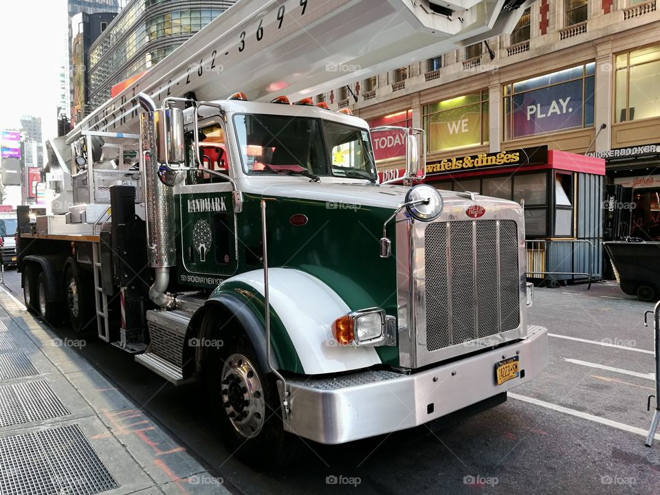 Green truck on the streets of New York
