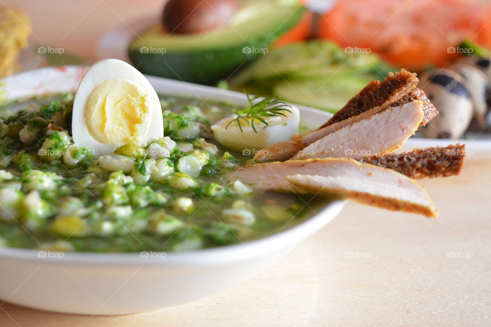 Soup in bowl with boiled egg