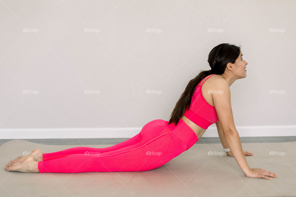 Woman doing yoga indoors 