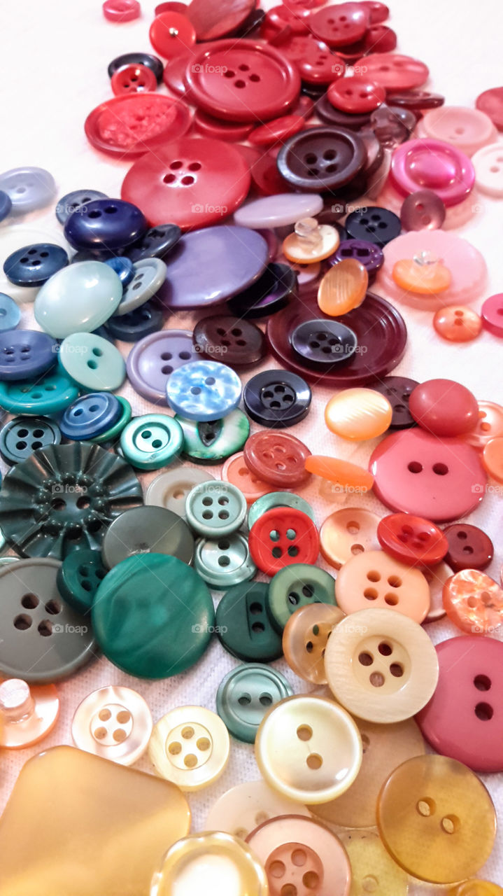 multicolored buttons. Pile of multicolor buttons