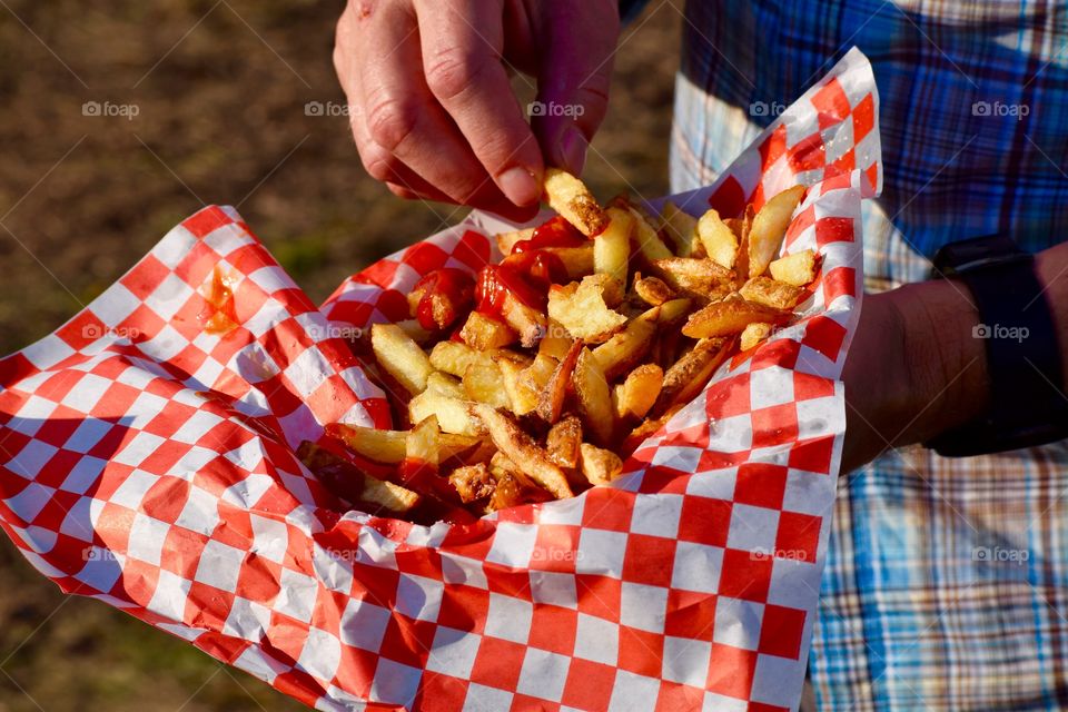 Close-up of person's hand with food