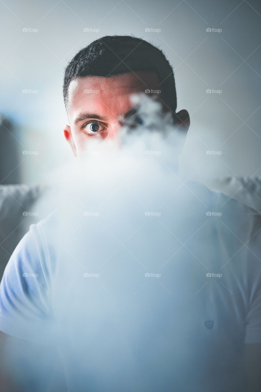 Man smoking while relaxed at home