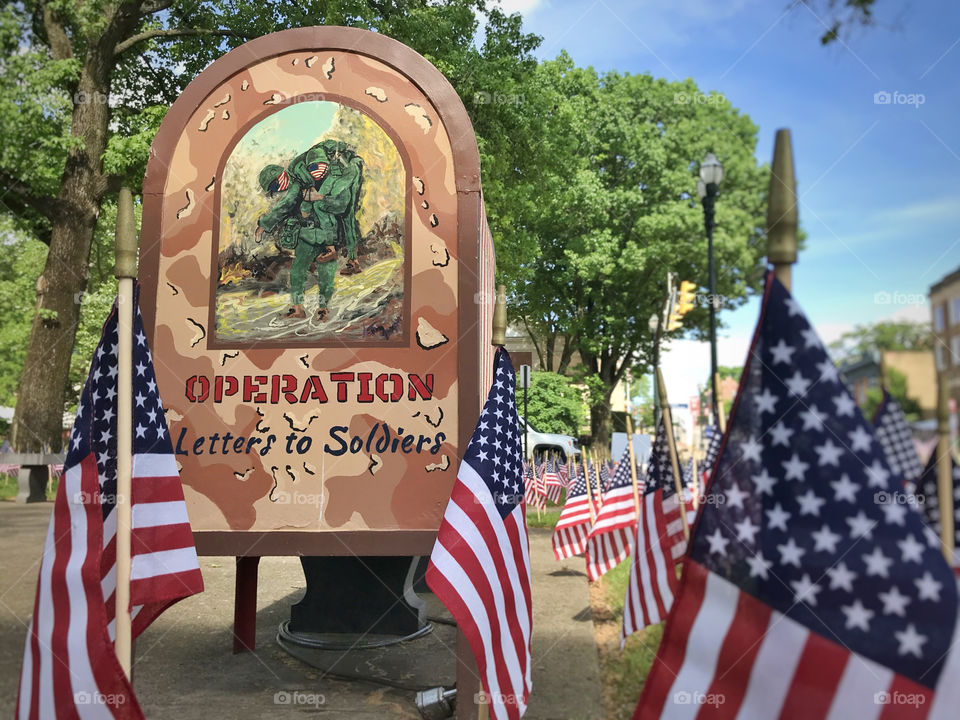 American flag with letters to soldiers mailbox