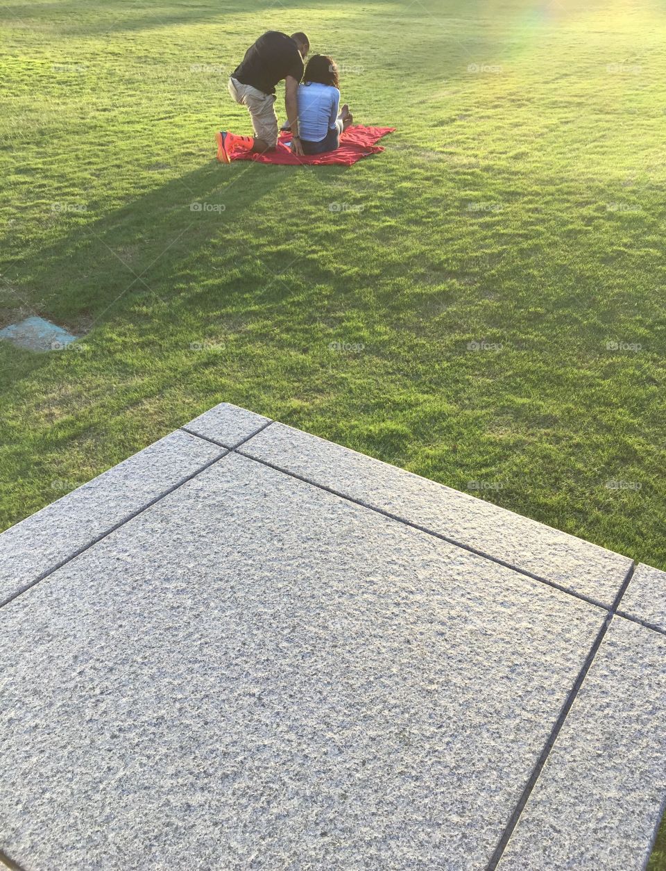 Couple in a park . Couple relaxing in evening at a park