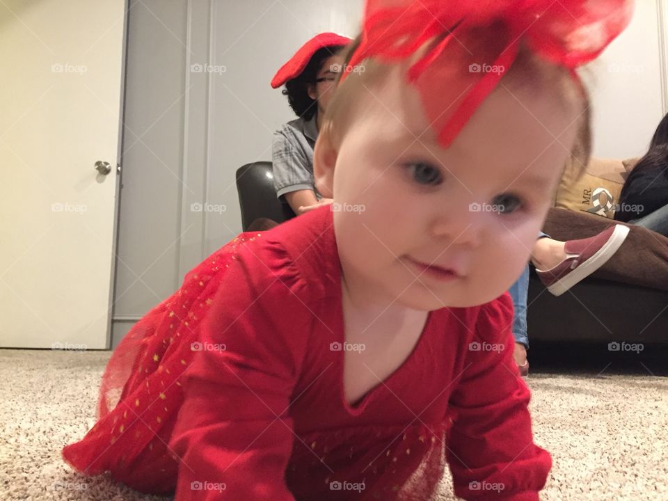 Baby in red bow 