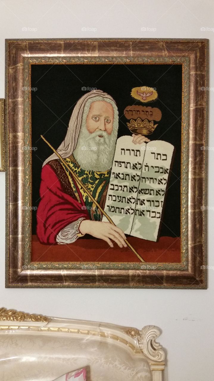 Moses holding the Torah