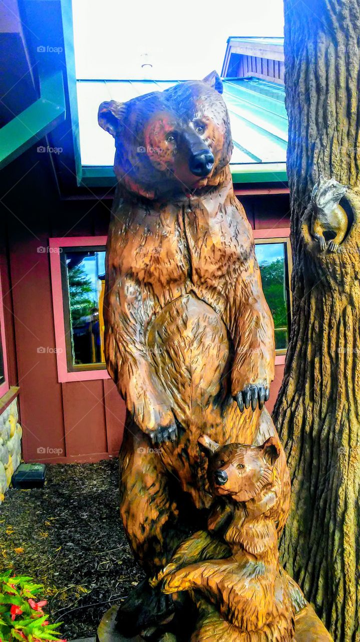 a bear and cub wood sculpture
