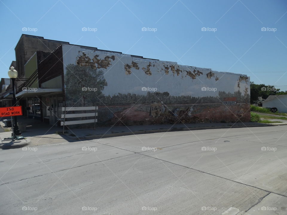 old west scene. This is a murial that is painted on the side of a building that I saw while out exploring East Texas