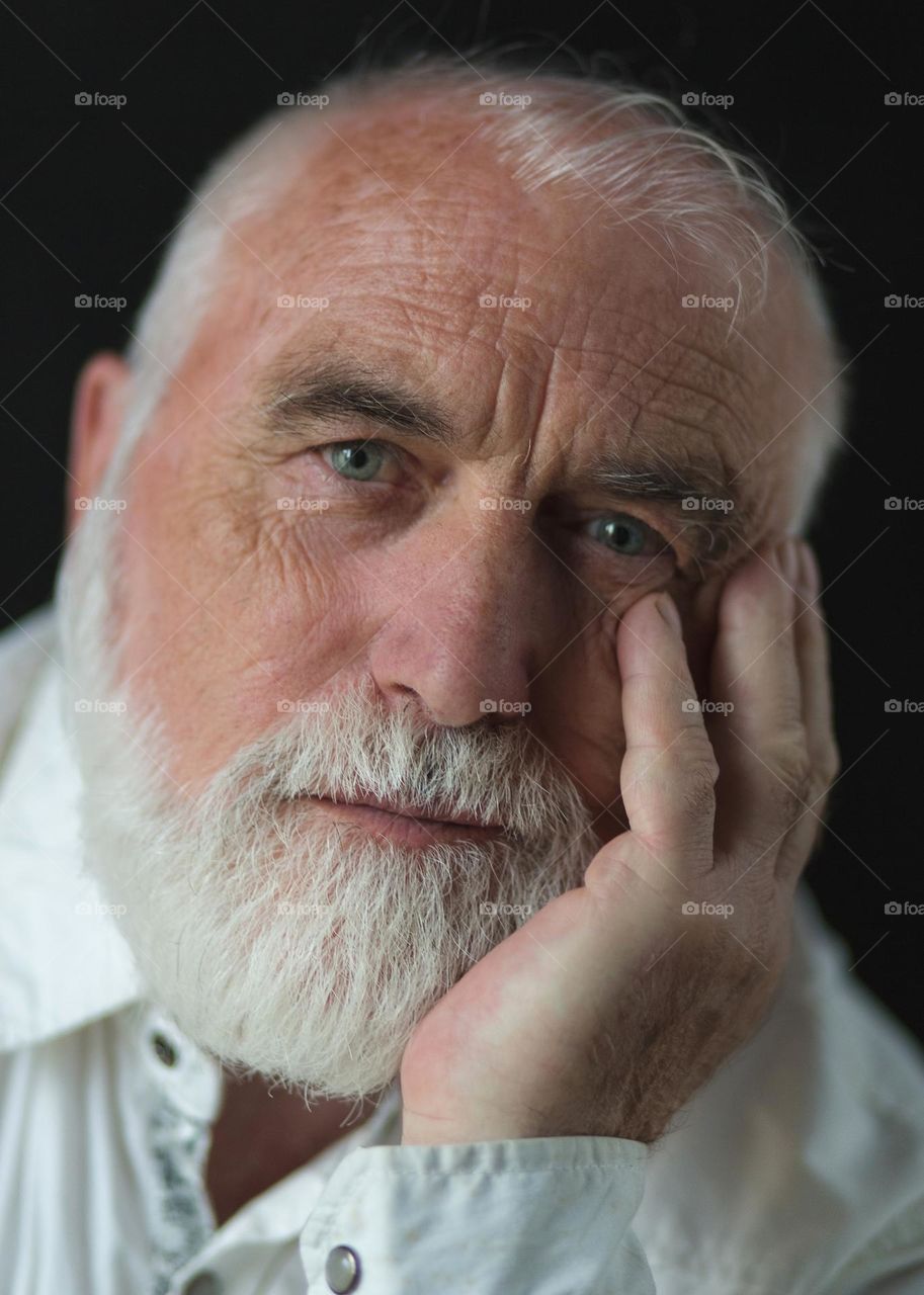 Portrait of an adult, emotions, wrinkles and the history of a person’s life in one portrait. Unique face skin stories