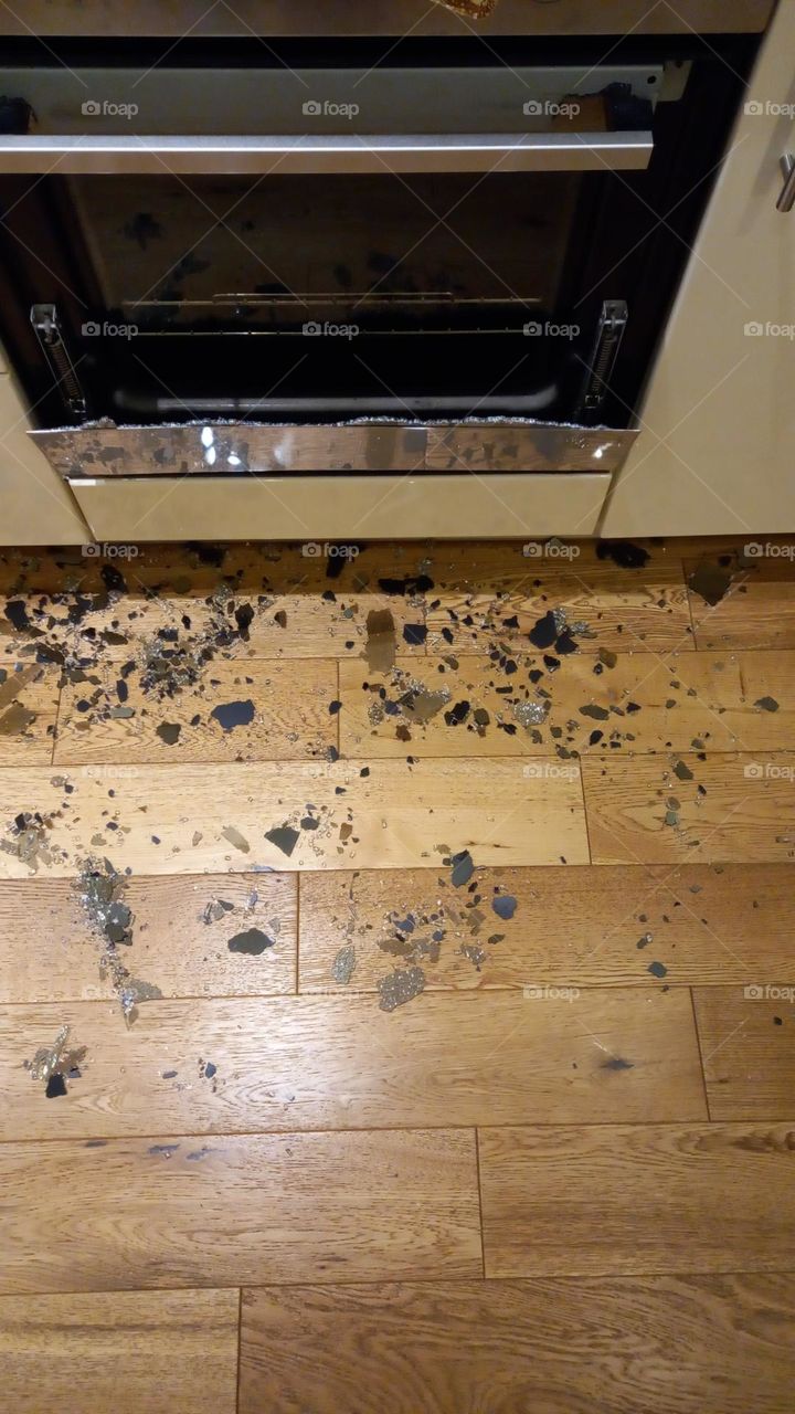 Oven front door explosion. Shattered glass on kitchen floor.