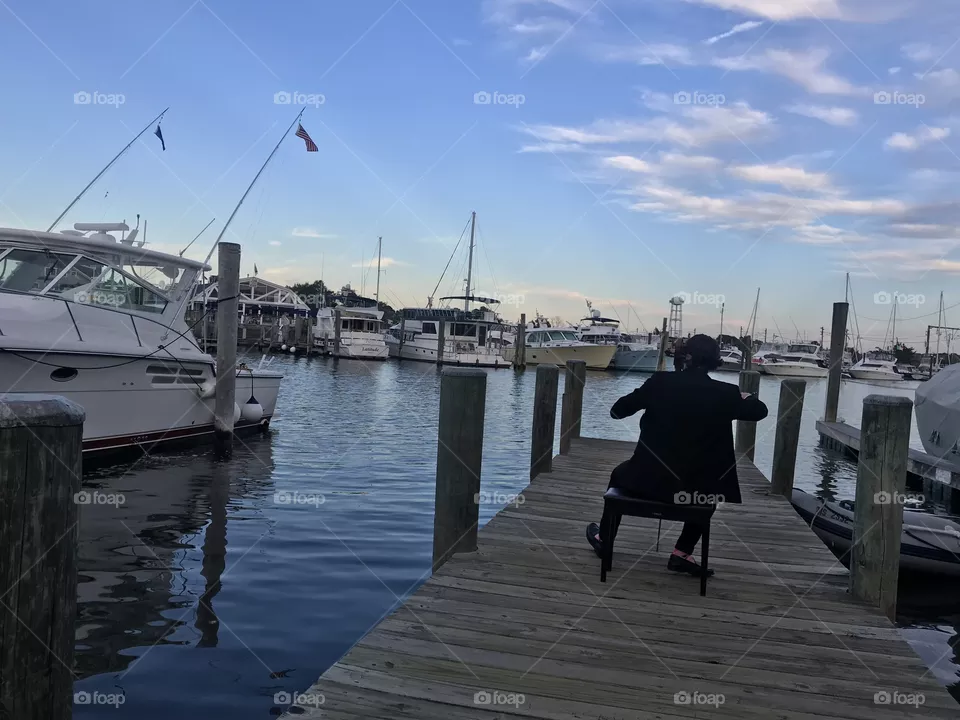 Cellist on a Mystic pier 