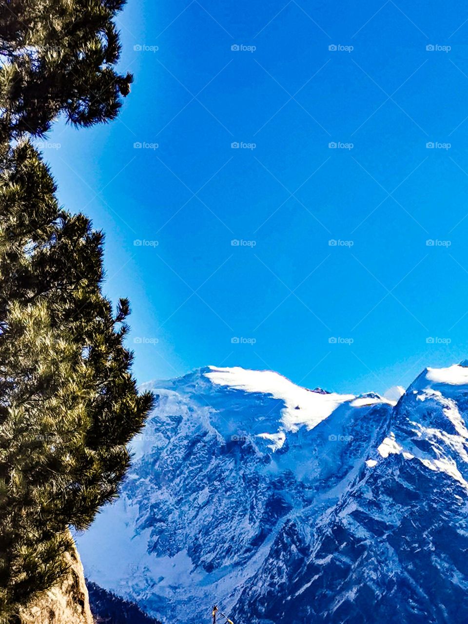 mountain peak scape wearing snow