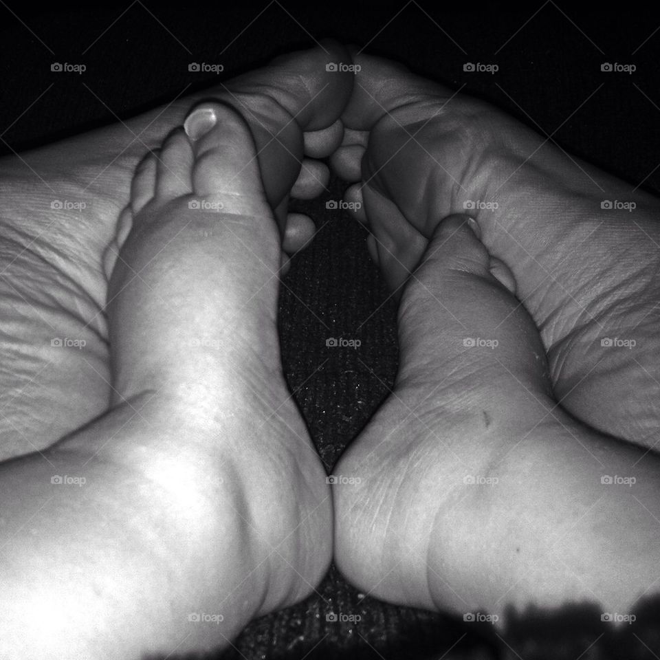 Colorless mommy and baby feet