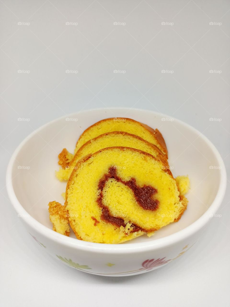 Yellow jam roll cakes isolated set on white background