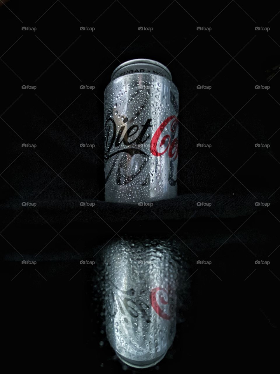 Diet Coke reflection, water drops